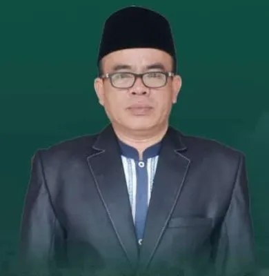Drs. KH. Atam Rustam, M.Si.
